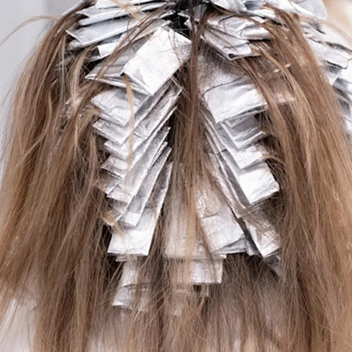 Woman getting highlights in her hair