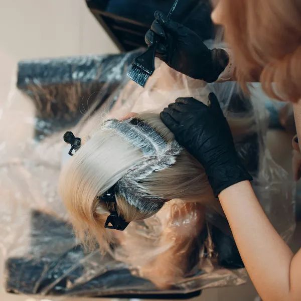 Woman getting her roots colored