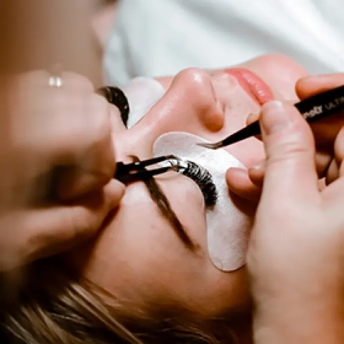 Woman getting eyelashes done